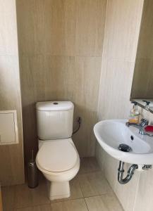 a bathroom with a toilet and a sink at Sunrise Lighthouse Golf Private Villa in Balchik +32 photos
