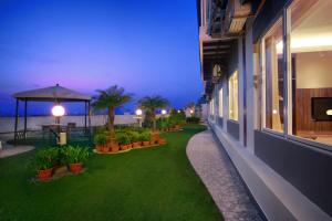 a balcony of a hotel at night with plants at favehotel LTC Glodok in Jakarta