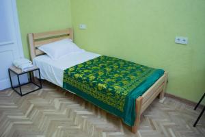 A bed or beds in a room at Sunflower Hotel