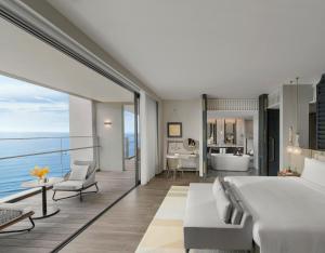 Katil atau katil-katil dalam bilik di Hoiana Hotel & Suites