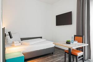 Postel nebo postele na pokoji v ubytování Hotel Amper