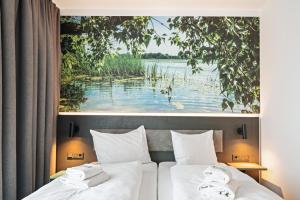 Postel nebo postele na pokoji v ubytování Hotel Amper