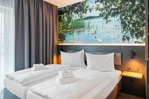 Postel nebo postele na pokoji v ubytování Hotel Amper + 37 fotografií