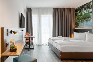 Postel nebo postele na pokoji v ubytování Hotel Amper