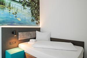 Postel nebo postele na pokoji v ubytování Hotel Amper