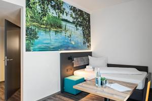 Postel nebo postele na pokoji v ubytování Hotel Amper