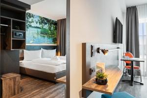 Postel nebo postele na pokoji v ubytování Hotel Amper