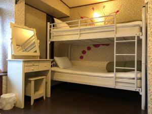 Postel nebo postele na pokoji v ubytování Hostel Yume-Nomad Kobe + 37 fotografií