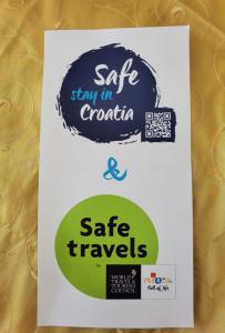 a sign that says safe stay in croatia and safe travels at Apartmani Kristijan in Crikvenica