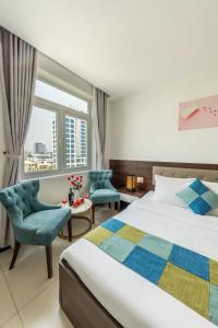 Postel nebo postele na pokoji v ubytování Phuc Thanh Luxury Hotel by THG + 37 fotografií
