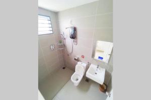 a bathroom with a toilet and a sink at The Pallet house @ Bandar Sri Sendayan (Seremban) in Kampong Gadong Jaya +23 photos