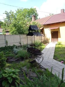 a bird feeder in the yard of a house at Park House in Rivne