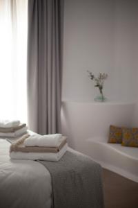 Vuode tai vuoteita majoituspaikassa Hotel Suite Generis