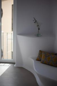 Vuode tai vuoteita majoituspaikassa Hotel Suite Generis