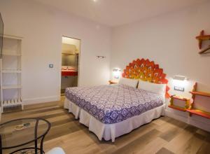 Posteľ alebo postele v izbe v ubytovaní Hostal Casa Arco Iris (Playa)