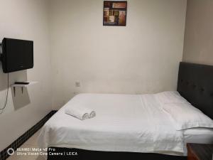 Postel nebo postele na pokoji v ubytování LSN Hotel (KL) Sdn Bhd