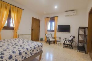 Posteľ alebo postele v izbe v ubytovaní Hostal Casa Arco Iris (Playa)