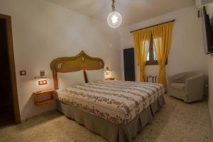Posteľ alebo postele v izbe v ubytovaní Hostal Casa Arco Iris (Playa)