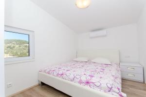 Postel nebo postele na pokoji v ubytování Apartments Drazen