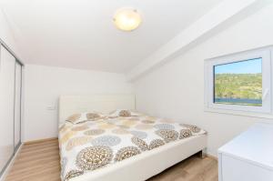 Postel nebo postele na pokoji v ubytování Apartments Drazen