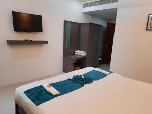 Voodi või voodid majutusasutuse Hotel SS Palace toas