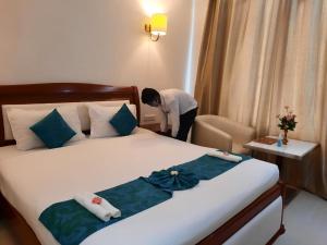 Voodi või voodid majutusasutuse Hotel SS Palace toas