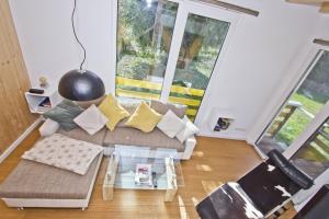 Posezení v ubytování strandnah,modernes Haus mit eigener Sauna, Garten, Terrasse - Ferienhaus SagaSol