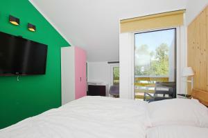 Postel nebo postele na pokoji v ubytování strandnah,modernes Haus mit eigener Sauna, Garten, Terrasse - Ferienhaus SagaSol