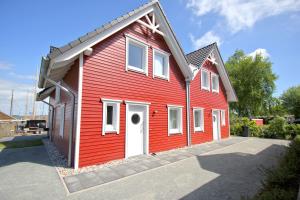 Imagen de la galería de hafennahes Ferienhaus mit Terrasse und Meerblick - Ferienhaus TimpeTe Steuerbord, en Gager