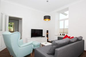 TV/Unterhaltungsangebot in der Unterkunft Ferienwohnung mit eigener Sauna in zentraler Lage - Kurhaus Nordstrand FeWo 32