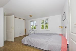 Postel nebo postele na pokoji v ubytování strandnahe Idylle am Meer, private Badestelle mit Strandkorb - Gutshof Ostseeblick FeWo Nr 02
