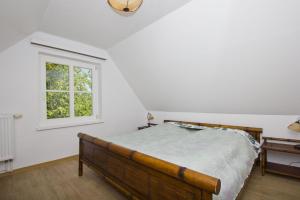 Postel nebo postele na pokoji v ubytování strandnahe Idylle am Meer, private Badestelle mit Strandkorb - Gutshof Ostseeblick FeWo Nr 02
