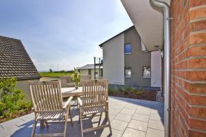 Μπαλκόνι ή βεράντα στο gemütliche Ferienwohnung mit Terrasse und Garten - Ferienhaus Zaunkönig FeWo EG