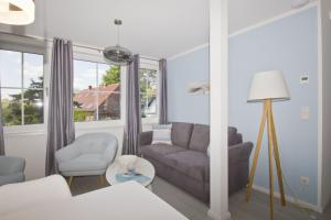 Χώρος καθιστικού στο Ferienwohnung mit Meerblick, Balkon und Garten - Haus Inselblick FeWo MEERluft