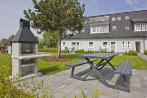 Zahrada ubytování moderne Ferienwohnung mit eigener Terrasse - Haus Inselwind FeWo MEERsand