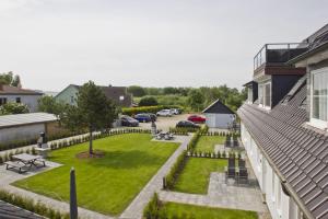 Zahrada ubytování moderne Ferienwohnung mit eigener Terrasse - Haus Inselwind FeWo MEERsand