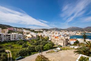 a cityscape of a town with a body of water at Amalthia Apartment in Karpathos Town