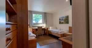 Postel nebo postele na pokoji v ubytování Appartementanlage am Arnumer See