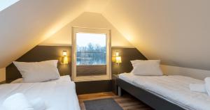 Postel nebo postele na pokoji v ubytování Appartementanlage am Arnumer See