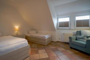 Postel nebo postele na pokoji v ubytování Appartementanlage am Arnumer See