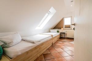 Postel nebo postele na pokoji v ubytování Appartementanlage am Arnumer See