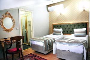 מיטה או מיטות בחדר ב-Lemis Suite Istanbul