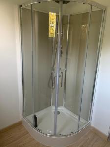 a shower with a glass enclosure in a bathroom at Studio indépendant Lisieux in Lisieux