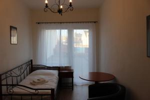 Postel nebo postele na pokoji v ubytování Hotel Černý kůň