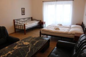 Postel nebo postele na pokoji v ubytování Hotel Černý kůň