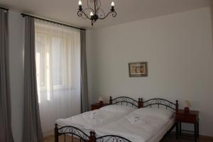 Postel nebo postele na pokoji v ubytování Hotel Černý kůň