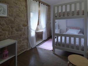 Postel nebo postele na pokoji v ubytování CASA VEIGA