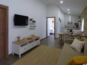 TV a/nebo společenská místnost v ubytování CASA VEIGA
