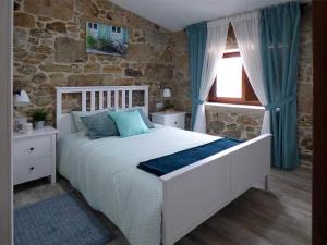 Ένα ή περισσότερα κρεβάτια σε δωμάτιο στο CASA VEIGA