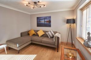 a living room with a couch and a table at Host & Stay - Amber Shores in Saltburn-by-the-Sea